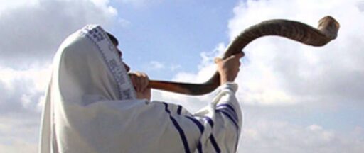 The priest blowing the shofar